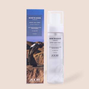 Rose Wasser Toner bottle placed beside floral printed packaging box